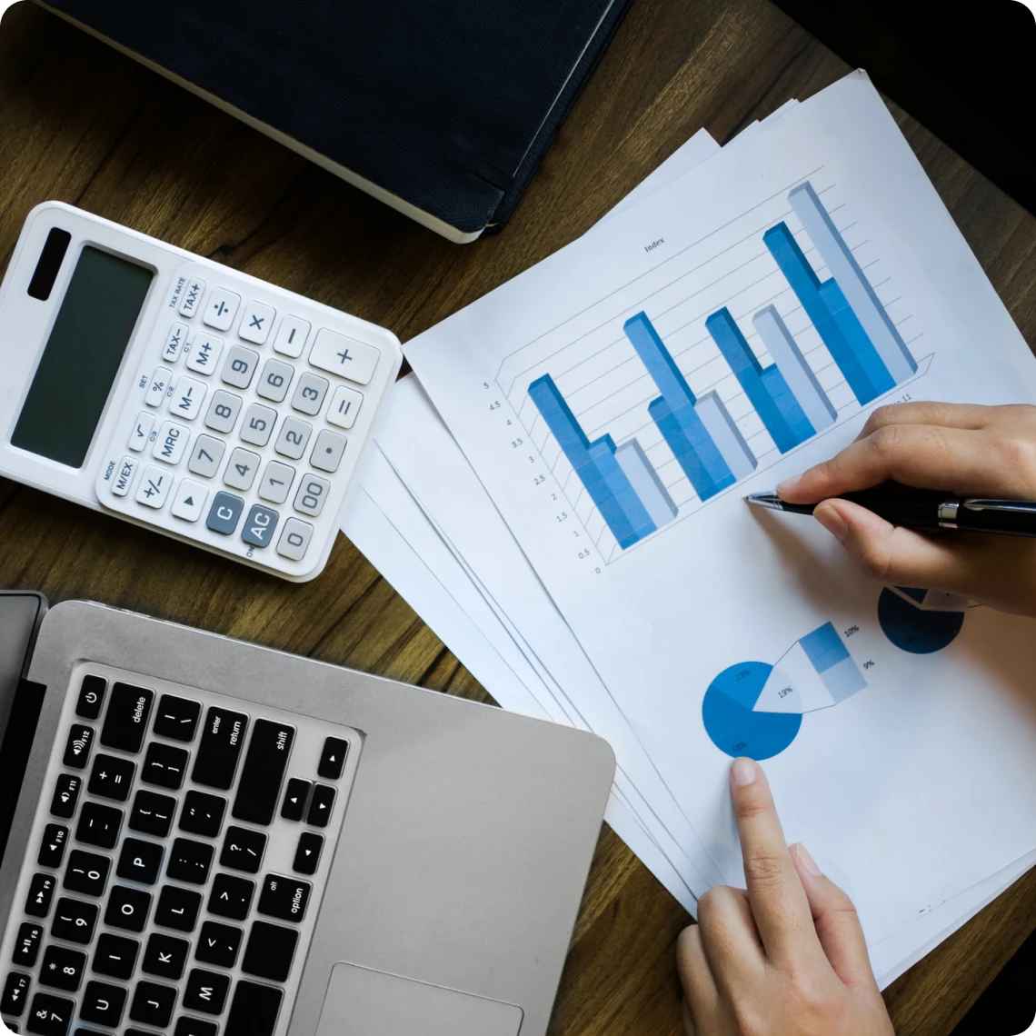 Financial analysis with laptop and documents