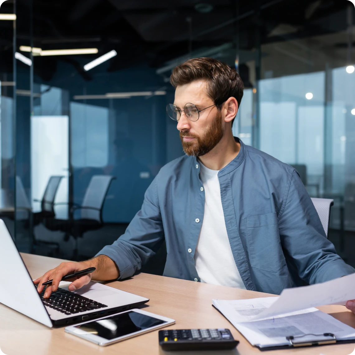 Individual focused on computer work