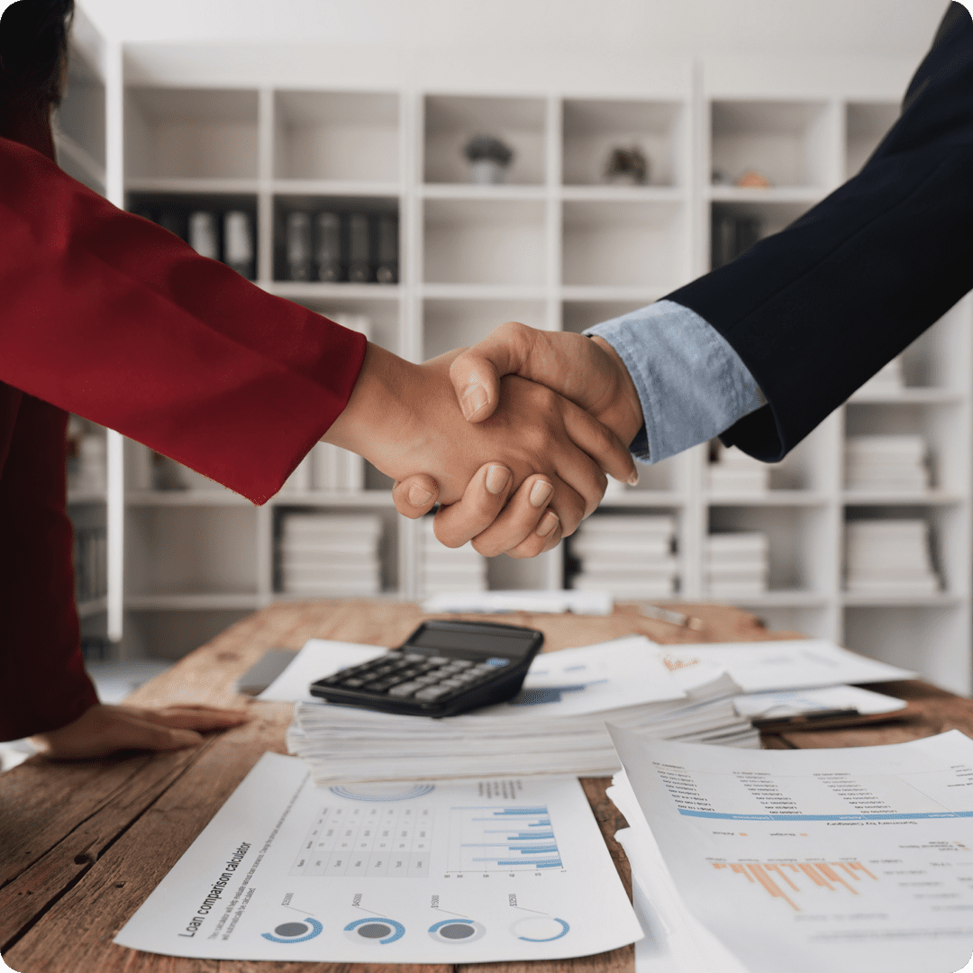Professionals shaking hands at work