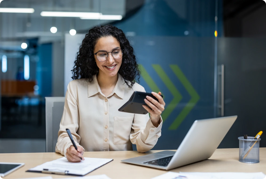 Professional writing notes in office setting